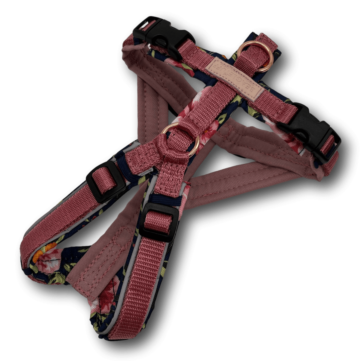 rosa und dunkelblau gemustertes Hundegeschirr mit floralem Muster, gepolstert, mit verstellbaren Gurten und schwarzen Schnallen, darauf ein
